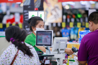 People wearing masks in store