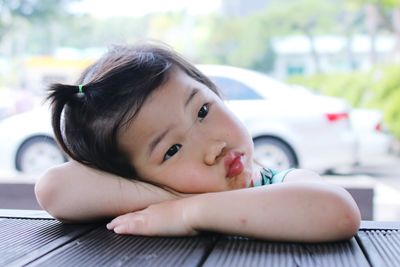 Close-up portrait of cute girl looking away