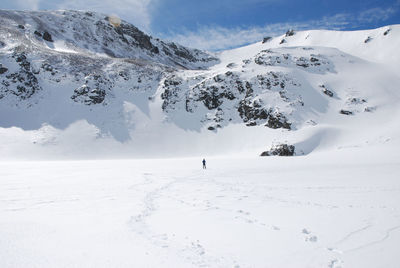 Scenic view of snow covered mountains and frozen lake