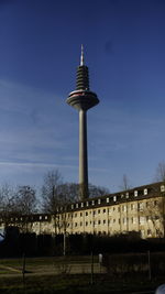 Low angle view of buildings against blue sky