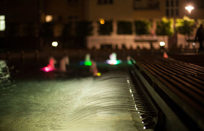 Surface level of wet street at night