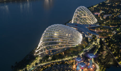 Illuminated modern buildings in city at night