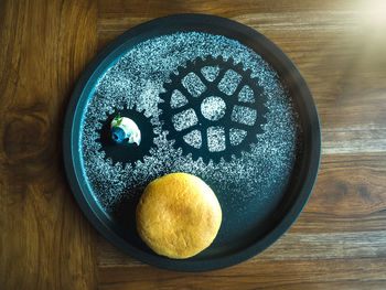 Directly above shot of food in plate on wooden table