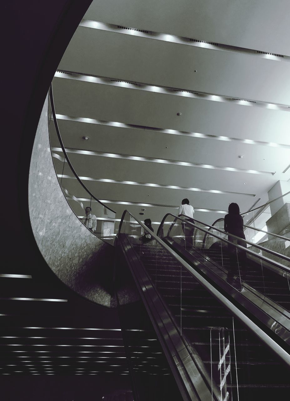 railing, staircase, steps and staircases, steps, real people, architecture, built structure, men, indoors, illuminated, lifestyles, large group of people, modern, women, togetherness, day, hand rail, sky, people