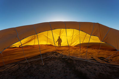 View of tent on land against clear sky