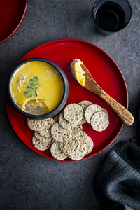 High angle view of pate and crackers served on table