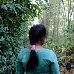 Rear view of woman in forest