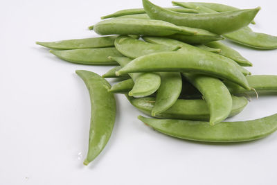 High angle view of green chili pepper on white background