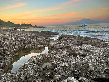 Scenic view of sea at sunset