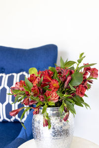 Close-up of vase on table against white background