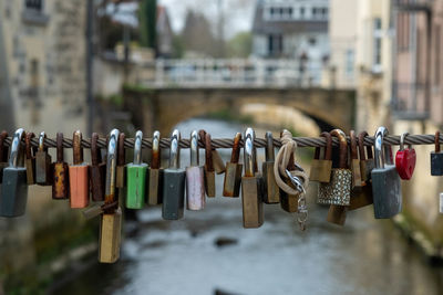 Close-up of padlocks hanging on railing