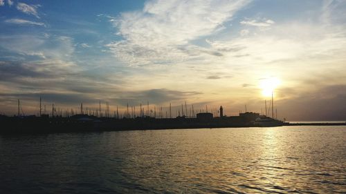 View of harbor at sunset