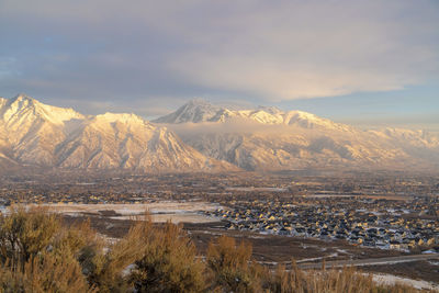 Scenic view of snowcapped mountains against sky