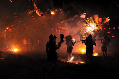 Silhouette of people at night