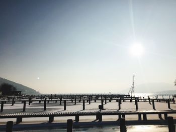 Bridge over sea against clear sky