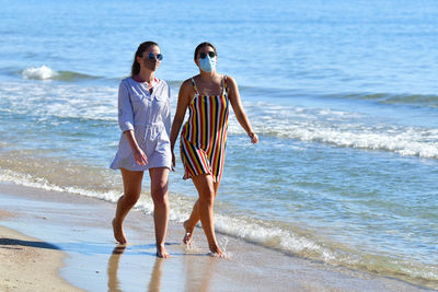 Women walking on beach