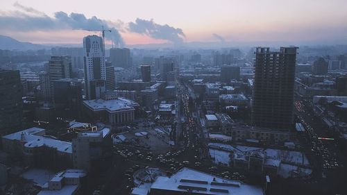 High angle view of buildings against sky during sunset