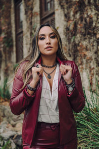 Portrait of beautiful young woman standing outdoors