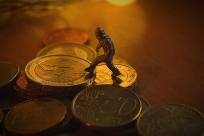 Close-up of coins on table