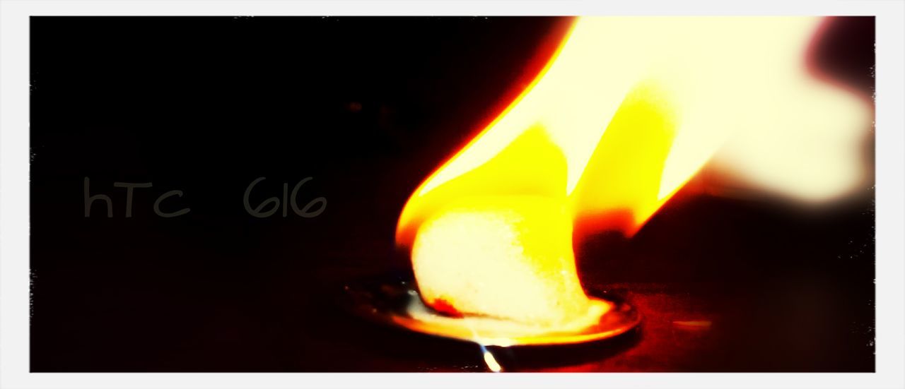 burning, flame, illuminated, fire - natural phenomenon, glowing, heat - temperature, night, close-up, fire, indoors, transfer print, candle, text, lit, western script, auto post production filter, dark, light - natural phenomenon, orange color, communication