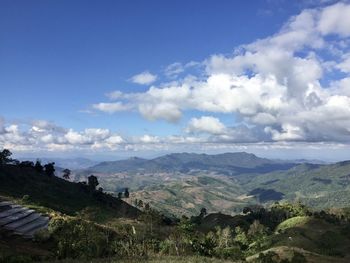 Scenic view of landscape and mountains against sky