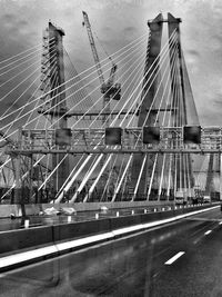 Bridge against sky in city