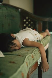 Young woman lying on bed at home. sleeping beauty. little girl sleep in the chair