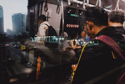 People on street in city at night