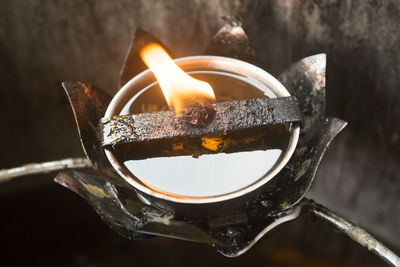 Close-up of burning candle