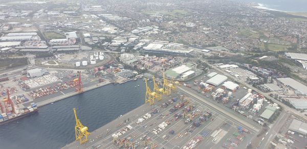 High angle view of cityscape by sea