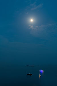 Scenic view of sea against sky at night