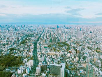 High angle view of city buildings against sky