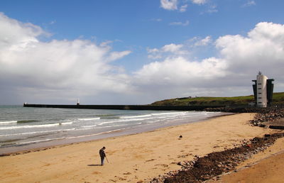 High angle view of man standing at beach