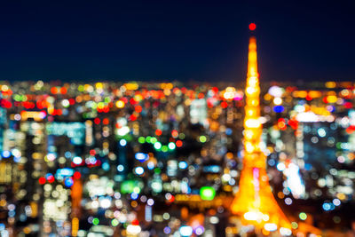 Defocused image of illuminated buildings at night