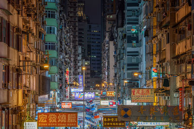 Illuminated city street at night