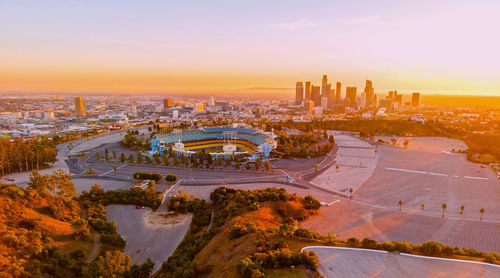 High angle view of city buildings during sunset