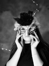 Close-up portrait of woman wearing mask