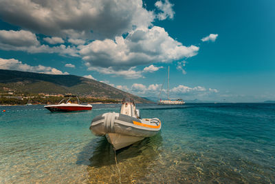 Boat in sea against sky