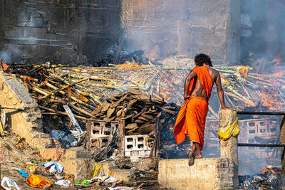 Rear view of man working at construction site