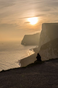 Scenic view of sea at sunset