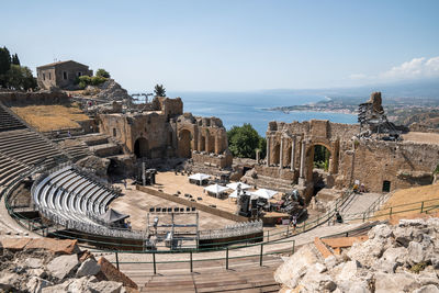 Panoramic view of old ruins of ancient greek theater at mediterranean seacoast