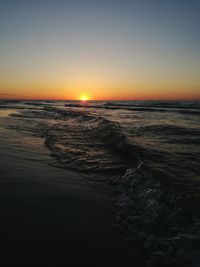 Scenic view of sea against sky during sunset