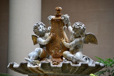 Angel sculptures on fountain