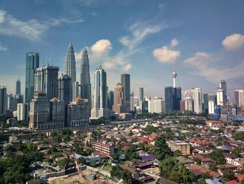 Modern buildings in city against sky