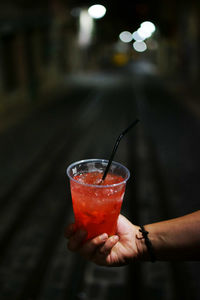 Close-up of hand holding wineglass