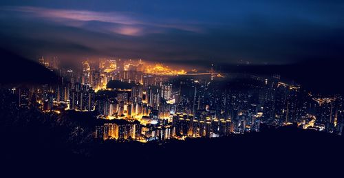 High angle view of illuminated buildings against sky at night from hong kong tai mo shan mountain