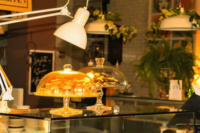 Illuminated lanterns hanging at home