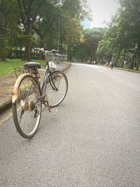 Bicycle parked on street in city