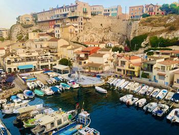 High angle view of townscape by sea