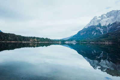 Scenic view of lake and mountains against sky